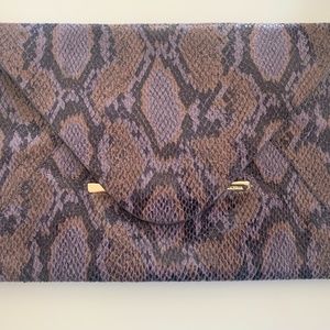 BCBG Max Azria purple snakeskin-like clutch with magnetic closure